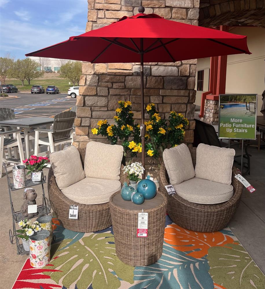 Patio furniture with accessories and an umbrella
